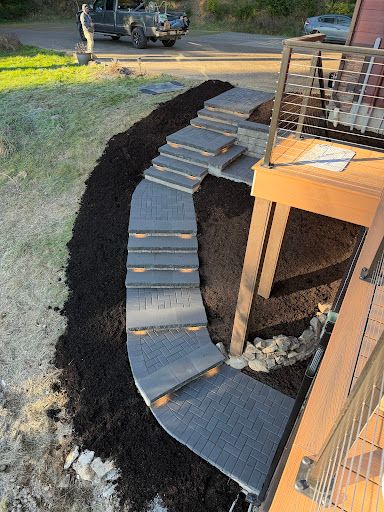 Curved paver walkway and steps installed by Ramo's Landscaping